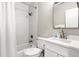 Bright bathroom featuring a shower-over-tub, with white tiles and modern fixtures at 1025 Scaup Ct, Kiawah Island, SC 29455