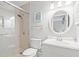 Bright bathroom featuring a shower, toilet, sink and vanity with modern fixtures at 1025 Scaup Ct, Kiawah Island, SC 29455