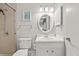 Bright bathroom featuring a shower, toilet, sink and vanity with modern fixtures at 1025 Scaup Ct, Kiawah Island, SC 29455