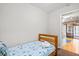 Small bedroom with a twin bed, closet and access to the outdoor patio at 1025 Scaup Ct, Kiawah Island, SC 29455