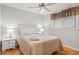 Cozy bedroom with ceiling fan, wood floors and a window with decorative valance at 1025 Scaup Ct, Kiawah Island, SC 29455