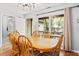 Charming dining room with hardwood floors, a view to the backyard, and a decorative artwork at 1025 Scaup Ct, Kiawah Island, SC 29455