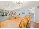 Dining and living room with an open floorplan, hardwood floors, and a cozy seating area at 1025 Scaup Ct, Kiawah Island, SC 29455