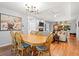Open-concept dining and living room area with hardwood floors and views of the beach at 1025 Scaup Ct, Kiawah Island, SC 29455