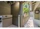Exterior elevator that leads to outdoor deck with American flag and a crab decoration hanging on the wall at 1025 Scaup Ct, Kiawah Island, SC 29455