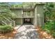 Inviting exterior view of a raised home with a covered carport and charming wood lattice at 1025 Scaup Ct, Kiawah Island, SC 29455