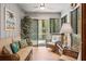 Cozy sunroom with comfortable seating, natural light, and views of the surrounding greenery at 1025 Scaup Ct, Kiawah Island, SC 29455