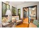 Bright sunroom featuring wicker seating, natural light, and access to the living area at 1025 Scaup Ct, Kiawah Island, SC 29455