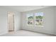 Bright bedroom with carpet, light walls, and two windows overlooking the neighborhood at 108 Lefton Lndg, Summerville, SC 29485