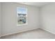 Neutral bedroom with carpet, large window, and view of the neighbor's home at 108 Lefton Lndg, Summerville, SC 29485