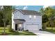 Charming two-story light blue home with a covered porch and a white garage door at 108 Lefton Lndg, Summerville, SC 29485