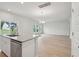 An open kitchen with granite countertops, stainless steel appliances, and modern lighting fixtures at 108 Lefton Lndg, Summerville, SC 29485