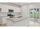 Stylish kitchen island featuring granite countertops and a view to the backyard at 108 Lefton Lndg, Summerville, SC 29485
