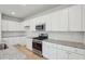 Bright kitchen features white cabinets, stainless steel appliances, and granite countertops at 108 Lefton Lndg, Summerville, SC 29485