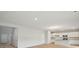 Bright, open-concept living room with hardwood floors leads to the modern kitchen at 108 Lefton Lndg, Summerville, SC 29485