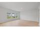 Bright living room with wood floors, recessed lighting, and three large windows at 108 Lefton Lndg, Summerville, SC 29485