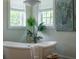 Clawfoot tub with vintage fixtures, natural light, and spa-like decor offering a relaxing ambiance at 108 Live Oak Dr, Mount Pleasant, SC 29464