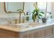 Close-up of bathroom features marble countertop, gold fixtures, and decorative accents, showcasing luxury at 108 Live Oak Dr, Mount Pleasant, SC 29464