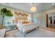 Bright bedroom featuring neutral tones, wood accents, and a decorative chandelier for a calming atmosphere at 108 Live Oak Dr, Mount Pleasant, SC 29464