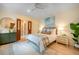 Bright bedroom featuring stylish decor, hardwood floors, and a ceiling fan at 108 Live Oak Dr, Mount Pleasant, SC 29464