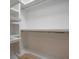 Clean, white closet with built-in shelving and hanging space for organized storage at 108 Live Oak Dr, Mount Pleasant, SC 29464