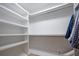 Bright, empty walk-in closet with custom shelving, ample storage, and room to organize your wardrobe at 108 Live Oak Dr, Mount Pleasant, SC 29464