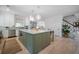 Bright kitchen with a large center island, modern appliances, and white cabinetry offers a clean, inviting space at 108 Live Oak Dr, Mount Pleasant, SC 29464