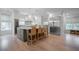 Spacious kitchen boasts an island with seating, stainless steel appliances, and modern lighting fixtures at 108 Live Oak Dr, Mount Pleasant, SC 29464