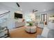 Open-concept living room with a seamless flow to the kitchen and dining area, creating a harmonious living space at 108 Live Oak Dr, Mount Pleasant, SC 29464