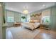 Inviting primary bedroom with natural light, a decorative ceiling fixture, and a calm and relaxing atmosphere at 108 Live Oak Dr, Mount Pleasant, SC 29464
