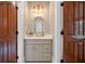 Elegant powder room with custom vanity, attractive lighting, and neutral decor at 108 Live Oak Dr, Mount Pleasant, SC 29464