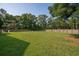 This home features a large backyard with a wooden fence at 108 Plume Poppy Ln, Ladson, SC 29456