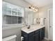 Bathroom vanity and mirror with decorative lighting above at 108 Plume Poppy Ln, Ladson, SC 29456