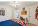 This is a bedroom with carpeting, a ceiling fan, and a desk at 108 Plume Poppy Ln, Ladson, SC 29456