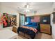 This charming bedroom features a desk, an American flag, and a ceiling fan at 108 Plume Poppy Ln, Ladson, SC 29456