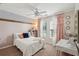 Bedroom with great natural light, stylish decorations, a ceiling fan and carpeted floors at 108 Plume Poppy Ln, Ladson, SC 29456