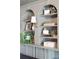 Stylish built-in shelving unit with decor and lots of storage spaces at 108 Plume Poppy Ln, Ladson, SC 29456