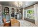 Sophisticated home office with custom built-ins, great natural light, and hardwood floors at 108 Plume Poppy Ln, Ladson, SC 29456