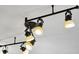 Close up of track lighting with five adjustable lamps, providing ample illumination for any space at 108 Plume Poppy Ln, Ladson, SC 29456