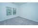 Comfortable bedroom with natural light from two windows and neutral carpeting at 1101 Twin Rivers, Wando, SC 29492