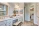 Bathroom featuring double sinks, a makeup vanity, and a view into the walk-in closet at 113 Magnolia House Dr, Summerville, SC 29486