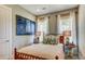 Cozy bedroom with soft lighting, comfortable bed, decorative artwork, and stylish side tables with lamps at 113 Magnolia House Dr, Summerville, SC 29486