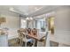 Dining room displaying a stylish chandelier, neutral wall paint and decor with an adjacent sitting room at 113 Magnolia House Dr, Summerville, SC 29486