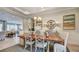 Dining room view featuring modern chandelier, neutral wall paint and decor, with an adjacent sitting room at 113 Magnolia House Dr, Summerville, SC 29486