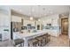 Open-concept kitchen featuring large quartz island, stainless steel appliances, stylish light fixtures, and bar stool seating at 113 Magnolia House Dr, Summerville, SC 29486