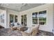 Covered patio with comfortable seating, perfect for outdoor relaxation and enjoying the backyard view at 113 Magnolia House Dr, Summerville, SC 29486