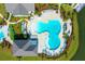 Aerial view of a modern community swimming pool area with many swimmers enjoying a day in the water at 113 Magnolia House Dr, Summerville, SC 29486
