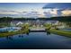 Community clubhouse overlooking lake with pool, beautifully landscaped grounds, and walking paths at 120 Magnolia House Dr, Summerville, SC 29486