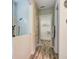 Bright bathroom featuring a glass shower and a glimpse into an organized walk-in closet at 120 Magnolia House Dr, Summerville, SC 29486