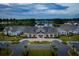 Beautiful clubhouse with classic architectural style, American flag, and manicured landscaping at 120 Magnolia House Dr, Summerville, SC 29486